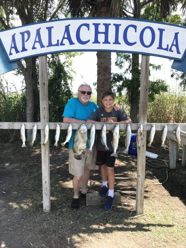 Apalachicola Fishing - Young boy with his catches