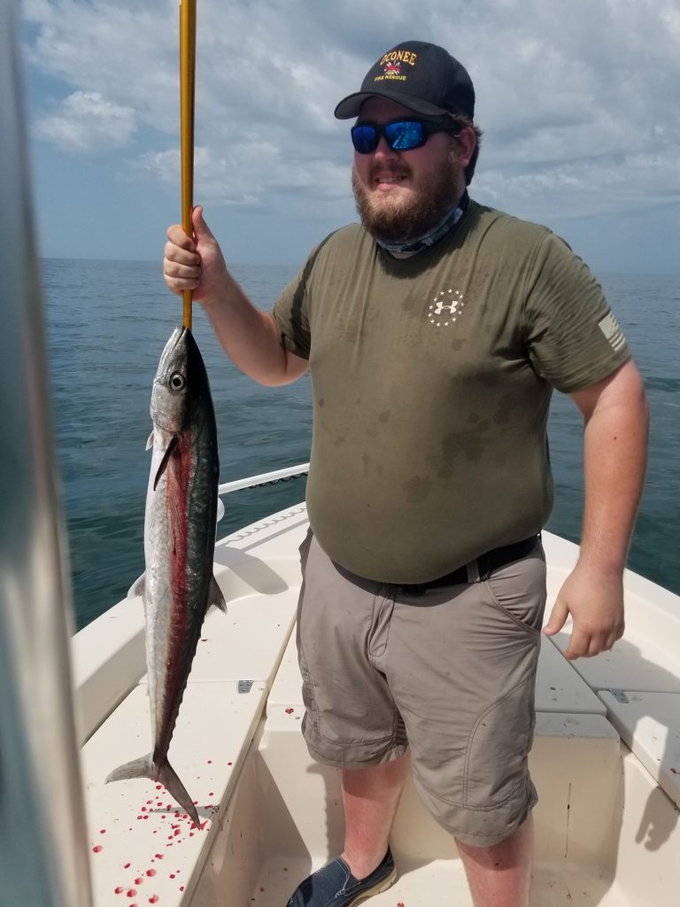 Man holding his catch caught on Apalachicola Saltwater Charters
