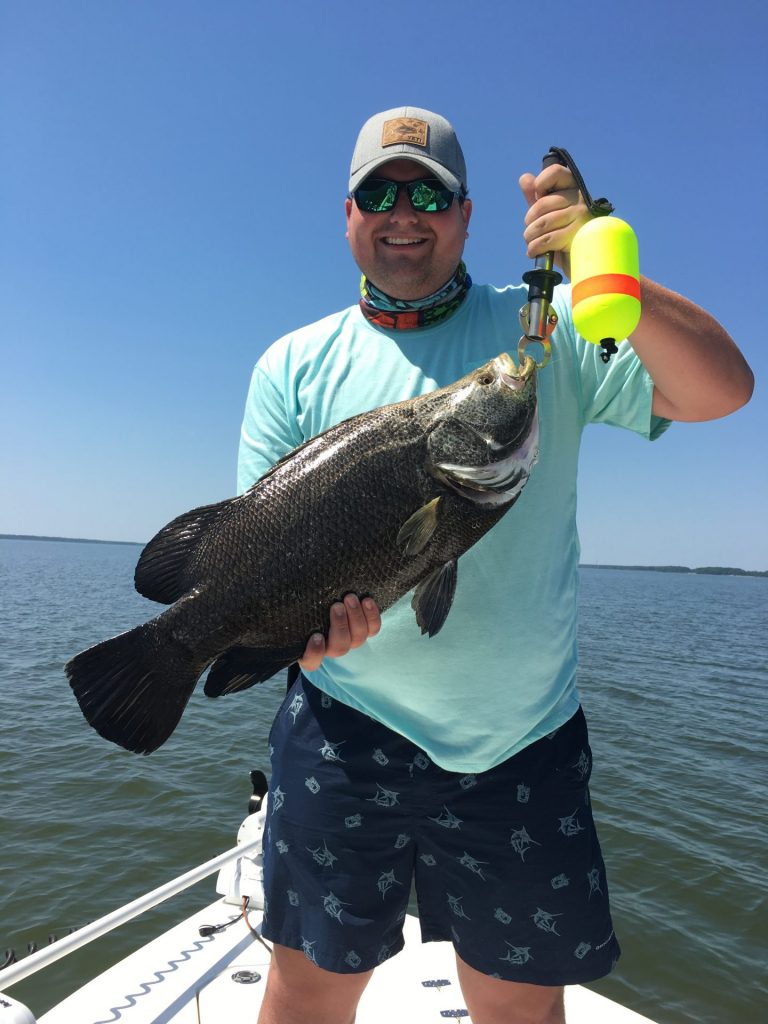 Happy angler from captain Zach's charter trip